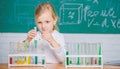 Future scientist. Explore and investigate. School lesson. Interesting approach to learn. Girl cute school pupil play Royalty Free Stock Photo