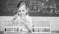 Future scientist. Explore and investigate. School lesson. Interesting approach to learn. Girl cute school pupil play Royalty Free Stock Photo