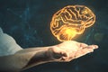 Future technologies and machine learning concept with digital glowing yellow human brain above man hand palms on abstract dark Royalty Free Stock Photo