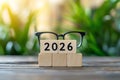Future Vision 2026 with Glasses and Wooden Blocks on a Natural Background Royalty Free Stock Photo