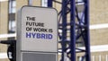 The Future of Work is Hybrid sign in a city setting under construction Royalty Free Stock Photo