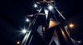 Futuristic abstract structure with triangular shapes in black silver and gold illuminated by bright light rays against dark Royalty Free Stock Photo