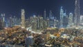 Futuristic aerial night cityscape with illuminated architecture of Dubai downtown, United Arab Emirates. Royalty Free Stock Photo