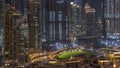 Futuristic aerial night cityscape timelapse with illuminated architecture of Dubai downtown, United Arab Emirates. Royalty Free Stock Photo