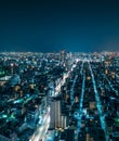 Futuristic Aerial View of City Rooftops at Night in Tokyo, Japan Royalty Free Stock Photo
