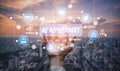 Futuristic AI Assistant Concept with Hand Holding Digital Interface Elements Overlooking City Skyline at Dusk. Tessel Royalty Free Stock Photo