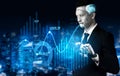 Futuristic Businessman Analyzing Stock Market Data with Augmented Reality Interface in a Modern Cityscape Environment at Royalty Free Stock Photo