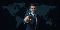 Futuristic Businessman Interacting with Futuristic UI Over World Map Royalty Free Stock Photo