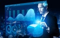 Futuristic Businessman with Robotic Features Analyzing Data and Graphs in a Modern Digital Workspace Impute Royalty Free Stock Photo