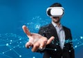 Futuristic Businessman Using Virtual Reality Headset to Explore Generative AI Technologies and Innovations in Artificial Royalty Free Stock Photo
