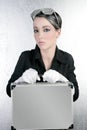 Futuristic businesswoman holding silver briefcase