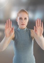 Futuristic Businesswoman touching air in front of blurred office