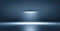 Futuristic circular ceiling light emitting focused beam in dark empty room with reflective floor and blue ambient lighting Royalty Free Stock Photo