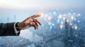Futuristic city data visualization with hand pointing toward glowing holographic network and urban technology interface Royalty Free Stock Photo