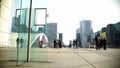 Futuristic city view, people walking and photographing modern Paris architecture