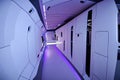 futuristic composition, a long corridor on a ship, neon lighting