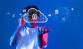 Futuristic Concept of Cloud Computing with a Person Interacting with Virtual Cloud Icons and Technology Symbols in a Royalty Free Stock Photo
