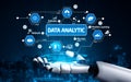 Futuristic Concept of Data Analytics in a Robotic Hand with Various Icons Representing Data, Technology, and Artificial Royalty Free Stock Photo