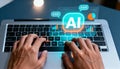 A futuristic concept image of artificial intelligence and digital assistance, showing a person typing on a laptop while a glowing Royalty Free Stock Photo
