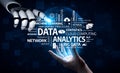 Futuristic Concepts of Data Analytics and Cloud Computing with Robotic Hand Interacting with Digital Elements on Dark Royalty Free Stock Photo