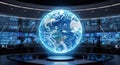 Futuristic control room with a glowing global network visualization displayed on multiple computer monitors in a dark concrete Royalty Free Stock Photo