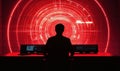 Futuristic control room with red circular patterns, silhouette of operator Royalty Free Stock Photo
