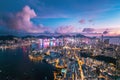 Futuristic cyberpunk view of the famous metropolis, night aerial view of Kowloong Hong Kong Royalty Free Stock Photo