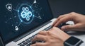Futuristic cybersecurity network graphic on laptop screen with hands typing Royalty Free Stock Photo