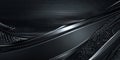 A futuristic dark silver carbon fiber background with intricate weave patterns and metallic shine.