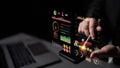 Futuristic Data Visualization on Smartphone with Touch Interaction Amidst Dark Background and Laptop Showing Graph and Royalty Free Stock Photo