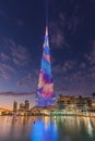 Futuristic decoration on Burj Kalifa tower at beautiful sunset