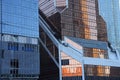 Futuristic design part of skyscrapers against a clear blue sky. Abstract facade design. Glass and metal in modern urban Royalty Free Stock Photo