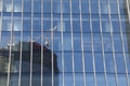 Futuristic design part of skyscrapers against a clear blue sky. Abstract facade design. Glass and metal in modern urban Royalty Free Stock Photo