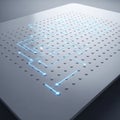 A futuristic digital circuit design on a sleek, metallic surface with a grid of raised dots. Royalty Free Stock Photo