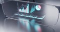 Futuristic digital display shows financial data and charts on modern desk Royalty Free Stock Photo