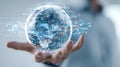 Futuristic digital globe with dynamic data streams in a human hand Royalty Free Stock Photo