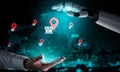 Futuristic Digital Interaction Between Human Hand and Robotic Arm with Business Location Icons on a Global Map Royalty Free Stock Photo