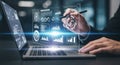 Futuristic digital interface technology interactive data display with hand using stylus on laptop Royalty Free Stock Photo