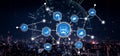 Futuristic digital network connecting various data analytics and technology icons over a city skyline at night with blue Royalty Free Stock Photo