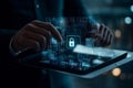 Futuristic Digital Security Interface with Hand Interacting with a Glowing Lock Icon on a Tablet Screen, Data Visualization Royalty Free Stock Photo