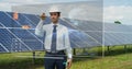 A futuristic engineer-expert in solar photovoltaic panels, uses a hologram with remote control, performs complex actions to monito