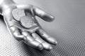 Futuristic euro business coin silver hand