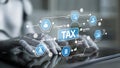 Futuristic Financial Technology with Robotic Hands Visualizing Tax Concepts and Data on a Digital Interface for Modern Royalty Free Stock Photo