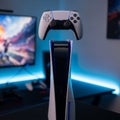 Gaming setup featuring a PlayStation 5 console and a DualSense Royalty Free Stock Photo