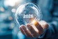 Futuristic globe with the year 2026 in a hand, representing technology and global progress Royalty Free Stock Photo