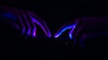 Futuristic glowing fingers touch a screen in a dark environment connecting through digital interface and communication network in Royalty Free Stock Photo