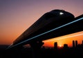 Futuristic high-speed train travels along an elevated track against a Royalty Free Stock Photo
