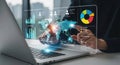 Futuristic holographic interface displaying global data and analytics on a laptop Royalty Free Stock Photo