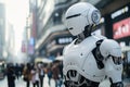 Futuristic humanoid robot with a sleek design standing amidst a busy urban street scene. Royalty Free Stock Photo