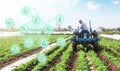 Futuristic innovative technology pictogram and a farmer on a tractor. Agricultural startups, improvements, digitalization